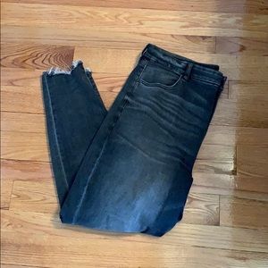 Super high waisted charcoal style ripped jeans.